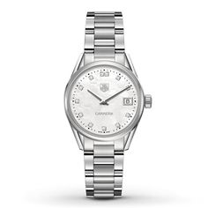 Diamonds mark the hours on the silver-tone dial of this elegant Carrera women's watch from TAG Heuer. The 32mm stainless steel case surrounds the Swiss quartz movement, and is topped by a scratch-resistant sapphire crystal. A push-button fold-over deployment clasp secures the stainless steel bracelet, and the women's watch is water-resistant to 100 meters. Tag Heuer Female Watch, Womens Tag Watch, Tag Heuer Watches Women Diamonds, Elegant White Diamond Watch With Chronometer, Elegant Diamond Watch With Date Indicator And Round Dial, Timeless Silver Diamond Watch With Chronometer, Elegant Diamond Watch With Date Indicator, Elegant Round Watch With Date Indicator, Elegant White Watch With Date Indicator