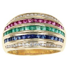 A Five Row Diamond, Blue Sapphire, Emerald, Ruby Invisibly Set Cocktail Ring made in 18 Karat Yellow Gold. The ring size is US 6.25. The total weight of the ring is 6.60 grams. Ruby Sapphire, Domed Ring, Channel Set, Vintage Diamond, Cocktail Ring, Cocktail Rings, Blue Sapphire, Sapphire Ring, The Row