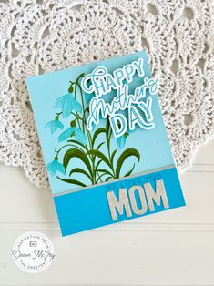 a card with the words happy mother's day written on it and a blue background