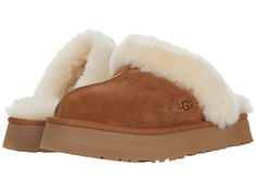 Find UGG Disquette on Editorialist. Elevate your comfort game with the UGG Disquette slipper. Premium construction and materials. Secure and comfortable fit. Slip on mule style. Open back. Cushioned footbed. Fur lined. Real, dyed fur from sheep originating from United States, UK, Spain, Ireland, Australia. Suede leather upper. Sheepskin collar, lining, and footbed. Synthetic outsole. Imported. Ugg Platform Slippers, Ugg Shoes Women, Ugg Coquette, Ugg Style, Chestnut Color, Slide Slippers, Suede Slippers, Ugg Slippers, Platform Slippers