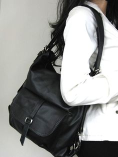 The Backpack/Handbag with backpack attachments is the perfect size to carry your daily essentials in style! The backpack is made from top quality leather. Thanks to solid nickel hardware in silver and leather construction this bag is ready to be with you on everyday occasion! This leather bag can be worn on your shoulder or on your back. By using the adjustable leather strap you can convert it into a backpack or handbag. This leather bag is a perfect everyday bag! There is a lot of space and you Backpack Purse Leather, Black Rucksack, Leather Backpack Purse, Black Leather Shoulder Bag, Leather Rucksack, Black Leather Backpack, Convertible Bags, Tote Bag Black, Shoulder Bag Black