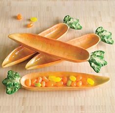 carrots and other vegetables are arranged on a cutting board