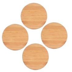 four wooden coasters sitting on top of each other in the shape of three circles