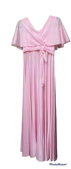 This pink maxi dress from the 1970's is splendid! Made of polyester and closest to a size medium, it is the perfect formal dress! Here are the exact measurements taken lying flat and doubled: Shoulders: 13 1/2 inches Chest: 32 inches Waist: 26 inches Shoulders to Hem: 55 1/2 inches Sweep: 42 inches This dress zips up the back to close and has gorgeous, fluttering half sleeves and a tie at the waist. Perfect to pair with wedges and an elegant updo for a classy look! Pink Flowy Maxi Dress For Prom, Pink Floor-length Maxi Dress For Prom, Flowy Pink Maxi Dress For Evening, Pink Full Length Maxi Dress For Spring, Vintage Pink Maxi Dress For Evening, Pink Maxi, Elegant Updo, Knoxville Tn, Flutter Sleeve Dress