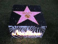 a star on the hollywood walk of fame is lit up in zebra - print material