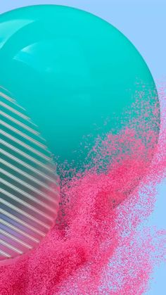 a blue and pink object is in the air with powder sprinkles all over it