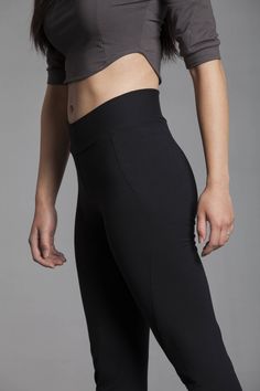 The high waist, slight flair, and curved seams on these ethically sourced, sustainable workout pants are sleek and flattering. They accentuate and enhance the natural curves and musculature of the body. Made out of organic cotton/soy french terry, the Ellipse Pants let your body breathe while keeping you warm.  Great pants for exercising, stretching, lounging,and travel!  Features include a thick waistband that can be folded over for a low-rise look and a slightly tapered bottom for a practical Sitting Yoga Poses, Organic Yoga Clothes, Cotton Yoga Pants, Organic Clothing Women, High Waisted Black Leggings, Black Yoga Pants, Fitness Leggings, Black Yoga, Yoga Pants Outfit