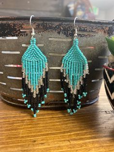 Fish Hook Top Beaded Earring Measures: 3" Turquoise Large Beads Drop Earrings, Turquoise Drop Earrings With Large Beads, Turquoise Beaded Earrings With Black Beads As Gift, Turquoise Dangle Earrings With Large Beads, Southwestern Green Beaded Dangling Earrings, Turquoise Earrings With Black Round Beads, Turquoise Chandelier Earrings With Colorful Round Beads, Adjustable Turquoise Earrings With Large Beads, Turquoise Dangling Bead Drop Earrings