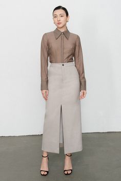 This trendy shirt offers a modern style and a luxurious feel. Crafted of 100% silk, it's comfortable to wear and features stylish straight sleeve cuffs. Instantly elevate your wardrobe with this versatile and timeless piece. Long Skirt Office Outfit, Minimalist Skirt, Khakis Outfit, Khaki Coat, Skirt Inspiration, Organza Shirt, Mean Blvd, Office Skirt, Skirt Blouse