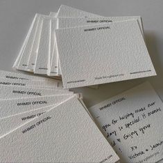 several pieces of white paper with writing on them