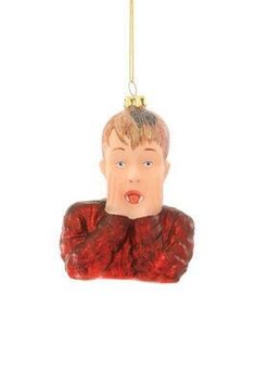 a christmas ornament with a man's head hanging from it