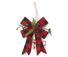 a red and black plaid bow hanging from a string