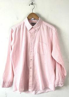 "-Description- >Mcgregor men's pink & white striped dress shirt >collared >button down >open pocket on the front >size 16 32/33 >so preppy! >condition: ok - a good amount of piling around the neck and under arms but still wearable >color(s): pink, white >fabric(s): 65 polyester / 35 cotton >brand: mcgregor >care: machine wash -Measurements- >size: 16 32/33 ✩ all measurements are taken with the item laying flat & some sizes are estimates so please check Summer Pink Cotton Dress Shirt, Pink Casual Collared Dress Shirt, Pink Collared Casual Dress Shirt, Casual Pink Collared Dress Shirt, Casual Pink Dress Shirt For Spring, Pink Cotton Button-up Dress Shirt, Vintage Pink Button-up Shirt, Casual Pink Cotton Dress Shirt, Classic Pink Cotton Shirt