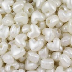 some white pearls are piled up together