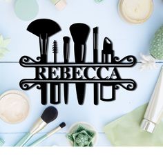 the word reebca is surrounded by makeup brushes