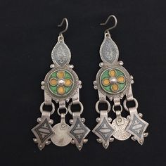 Handmade from southern Morocco- lakhssas. Very old and beautiful earrings with enamel and niello. The ear pin is suitable for the ear. In good condition. *weight: 27.4 gram *length and width: 9 cm / 2.6 cm If there is any other question sand me a message and i will be very happy to answer it as son as possible. Visit my store: https://www.etsy.com/fr/shop/Berberjewelery Bohemian Meenakari Earrings For Ceremonial Occasions, Silver Meenakari Earrings For Festivals, Bohemian Enamel Jewelry, Bohemian Enamel Pierced Jewelry, Bohemian Antique Silver Metal Earrings, Ceremonial Silver Meenakari Earrings, Berber Earrings, Bohemian Meenakari Metal Earrings, Vintage Silver Oxidized Danglers