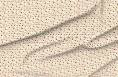 a white and red fabric with small dots on it