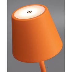 an orange lamp with a white light on it