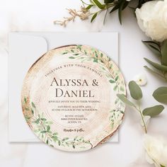 wedding stationery with white flowers and greenery