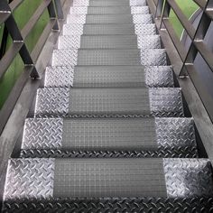 the stairs are made of metal and have treads