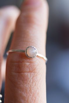 Tiny skinny stackable ring with beautiful Peach Moonstone. It is made with a skinny but sturdy band, perfect for everyday wear. It is a gentle and delicate piece, which you may wear alone or stacked. It is a great every-day jewel which will perfectly suit any occasion and any outfit. The ring is 0,8-0,9 mm thick and looks very dainty on the finger. Choose the size of the stone (3 or 5 mm) and material for the ring (sterling silver or 9k gold). If you want to change the ring band design or get a Dainty Stackable Moonstone Jewelry, Adjustable Stackable Moonstone Ring For Everyday, Dainty Moonstone Stackable Rings For Gift, Dainty Moonstone Stackable Rings As Gift, Dainty Adjustable Moonstone Ring For Everyday, Stackable Moonstone Ring, Everyday Dainty Moonstone Ring, Dainty Moonstone Ring For Everyday, Adjustable Stackable Moonstone Promise Ring