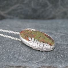 This Scottish gemstone pendant has beautiful silver ferns hugging the stone.  The gorgeous gemstone is a Lewisian Gneiss found in the Hebridean islands of Scotland and is the oldest gemstone found in Scotland at 3000 million years old.  Imagine being able to wear a piece of jewellery with a stone as old as that.  It would make a wonderful gift for a milestone birthday, an anniversary or a birthday gift for a nature lover. I have handmade this pendant from recycled sterling silver and an oval Lew Fern Necklace, Silver Fern, Outer Hebrides, Jewellery Unique, Unique Jewelry Gifts, Jewelry Tattoo, Milestone Birthday, Gemstone Jewellery, Jewellery Gift