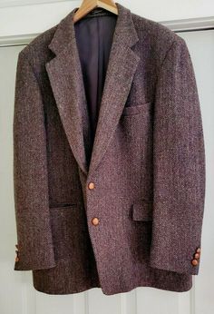 Stunning vintage Harris Tweed blazer in a brown, almost purplish herringbone speckled with various colors - the weave on this is simply extraordinary. Tonal contrast leather buttons to front and sleeves. Two front flap pockets, chest pocket, two interior pockets, single vent in back. In excellent condition to boot - looks like it was barely worn. Just a fantastic blazer. No size tag, so please note the dimensions, which conform to Long sizes for a tall man: Chest: 24” Sleeves: 27" Length, top of Vintage Tweed Jacket For Formal Occasions, English Gentleman Style Vintage, Retro Brown Tweed Blazer, Vintage Wool Tweed Jacket With Herringbone Pattern, Man Chest, Brown Tweed Single-breasted Blazer, Vintage Single-breasted Tweed Jacket, School Blazer, Tailored Brown Single-breasted Tweed Jacket