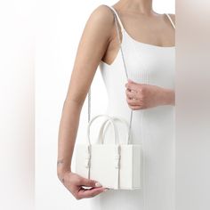 Brand New Condition. Never Been Used. Mini Leather Tote Bag From Kara Featuring Ivory White, Top Zip Fastening, Two Flat Top Handles, Chain-Link Shoulder Strap, Main Compartment And Main Compartment. Luxury White Square Evening Bag, White Shoulder Box Bag With Dust Bag, White Square Box Bag With Dust Bag, White Satchel With Silver-tone Hardware For Formal Occasions, White Crossbody Evening Bag For Shopping, White Formal Satchel With Silver-tone Hardware, Trendy White Rectangular Box Bag, White Bags With Pearl Handle For Daily Use, Box Shoulder Bag With Chain Strap For Shopping