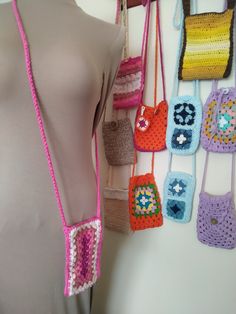 Small crossbody or shoulder bag handmade in crochet. Perfect for mobile, wallet and keys. In fuchsia pink on 1 side and shades of pink on the other in a rectangular Granny Square design. With button closure. Measurements: width 10 cm, height 17 cm, handle length in the center 62 cm. It can be done in other colors or sizes. Check by message please. Orders are made in 10 - 14 days Small cross body or shoulder bag handmade in crochet. Perfect for mobile phone, purse and keys. In plain fuschia pink Pink Square Phone Bag For Daily Use, Pink Square Phone Bag For Everyday Use, Summer Pink Crochet Bag With Adjustable Strap, Summer Pink Crochet Crossbody Bag, Casual Pink Crochet Bag With Adjustable Strap, Casual Pink Crochet Crossbody Bag, Pink Crochet Bag With Adjustable Strap For Everyday Use, Pink Crochet Crossbody Bag For Everyday, Pink Crochet Crossbody Bag For Daily Use