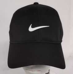 This Nike Dri-Fit Club Cap is the perfect accessory for any occasion. The hat features an adjustable strap and the iconic Nike Swoosh logo. It is made from high-quality polyester material, ensuring a comfortable fit and durability. The hat is suitable for both men and women and comes in the classic black and white color scheme. Whether you're playing sports, traveling, or just running errands, this Nike hat is a must-have. Its solid pattern and structured design make it a versatile piece that can be worn in any season. Upgrade your wardrobe with this stylish and functional hat today! New and Unused Condition (see photos for measurements) Any questions please ask Fast Shipping!!!!! Black Nike Cap, Fit Club, Nike Cap, Nike Hat, Nike Swoosh Logo, Structured Design, Playing Sports, Black And White Color, Fitness Club