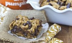 chocolate chip oatmeal cookie bars on a napkin next to a baking dish