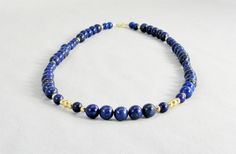 Rich, bold, beautiful colors in a classic and elegant style! These blue lapis lazuli beads have gold pyrite flecks and are accented with 14 karat gold filled polished beads. Lapis has been a prized semi-precious stone for centuries due to its intense color. The necklace is made ready to ship in two lengths -- 20 inch and 16 inch (51 cm and 41 cm). Please send a custom order request if you need a different length. This necklace and all KBeadsIt jewelry ships free with USPS first class domestic sh Turquoise Gemstone Earrings, Jewelry Royal, Freshwater Pearl Jewelry, Lapis Lazuli Beads, Buy Bead, Natural Stone Jewelry, Blue Lapis, Blue Gemstones, Sterling Silver Hoops