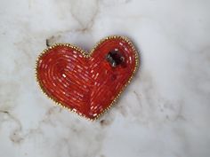 A luxurious brooch will be a unique gift for your mom, girlfriend, boyfriend, sister, colleague.  Spectacular brooch will fit with any clothes or a hat. I carefully design and create each jewelry. This is unique design. Each brooch is hand made with love. Find more accessories: https://www.etsy.com/shop/JustKnititUA Orders will be shipped within 1-3 business days. Heart-shaped Brooches For Valentine's Day Gift, Heart-shaped Brooch For Valentine's Day Gift, Heart-shaped Pins For Valentine's Day Gift, Heart-shaped Valentine's Day Brooch Pin, Heart-shaped Valentine's Day Party Brooches, Heart-shaped Valentine's Day Pins, Heart-shaped Brooch Jewelry Gift, Valentine's Day Gift Brooch Pins, Handmade Heart Brooches For Valentine's Day