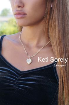 "This amazing locket necklace will feature your initials in pretty script font. Necklace comes with large link chain. Locket is ideal keepsake, perfect for gift-giving. personalize it with 2 photos inside. Back of the locket is engravable with name, date or initials. Designs by Keti Sorely. Available Metal - Sterling Silver - Sterling Silver with 24K yellow gold overlay - Sterling Silver with 14K rose gold overlay Locket size is 0.8\". Comes with large link chain. Choose necklace length. ------N Pretty Script Fonts, Chain Locket, Heart Locket Necklace, Gold Overlay, Heart Locket, Script Font, Locket Necklace, 2 Photos, Hand Engraving