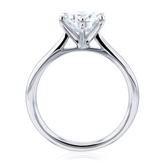 a diamond engagement ring on a white background