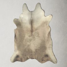 a cowhide rug on a white background