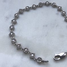 This is a beautiful and one of a kind diamond bracelet, crafted in 14K White gold. The mill-grain detail gives it an antique look. The clasp is a sturdy lobster clasp and length is a hair over 7 inches. 7.92 grams of 14K White Gold Approximately 2 carat of diamonds. This bracelet would make a beautiful wedding gift. With any pre-owned/Vintage/Antique items, it is common to have some wear, As we inspect each piece of our jewelry, we make sure the wear and tear is acceptable within industry standa Blue Green Sapphires, Antique Engagement, Unique Diamonds, Green Tourmaline, 2 Carat, Vintage Diamond, Unique Charms, Antique Items, Chain Link Bracelet