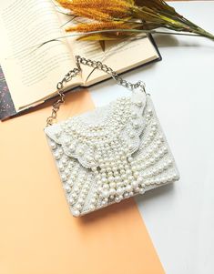 Chic Off-White Pearl Beaded Bridal Clutch | Handcrafted Envelope Wristlet with Elegant Fringe | Beaded White Clutch Bag | Handmade Pearl Clutch Purse with Silver Chain - Chic Bridal Evening Bag Discover the charm of handcrafted elegance with our Pearl Clutch Purse, a perfect blend of classic allure and modern sophistication. Designed for the discerning bride and fashion-forward guest, this clutch is adorned with delicate faux pearls, offering a touch of retro glamour. The versatile silver chain Pearl White Beaded Evening Bag For Party, Pearl White Beaded Clutch For Evening, Pearl White Beaded Shoulder Bag For Party, Beaded Handheld Clutch For Events, Beaded Pouch Evening Bag For Events, White Beaded Evening Clutch, Pearl White Beaded Rectangular Evening Bag, White Embellished Pouch Evening Bag, Beaded Pouch Clutch For Party