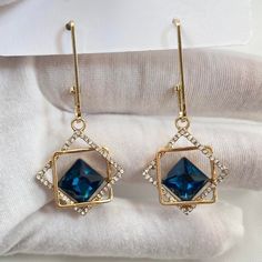 Elevate your look with these stunning CZ Blue Crystal Dangle Drop Earrings. The radiant blue crystals add a touch of glamour to any outfit. Perfect for any occasion, these earrings are sure to make you stand out and feel confident. Add a pop of color to your wardrobe today! Material: Brass/Sterling Silver Needle Earrings Size: 2.1"x0.9" Sapphire Drop Crystal Earrings, Elegant Sapphire Crystal Dangle Earrings, Elegant Sapphire Crystal Drop Earrings, Blue Dangle Earrings With Sparkling Stones, Sapphire Crystal Drop Earrings, Elegant Sapphire Crystal Earrings For Pierced Ears, Elegant Blue Crystal Earrings For Party, Blue Sparkling Dangle Earrings, Blue Dangle Crystal Earrings For Evening