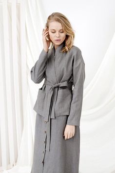 Linen Wrap Cardigan, Linen Loungewear, Kimono CardiganD E S C R I P T I O N- Loose fit- Dropdown shoulders- Kimono collar- Long sleeves- Two large front pockets- Short length- Belt D E T A I L S- Name: BERLIN• Sizes: XS - XXL• 100% European soft and washed linen fabric (weight 206 g/m² | 6.49 oz/yd²). Fabric is woven according to universally accepted quality requirements, which correspond to OEKO-TEX® Standard 100 certified.• Model (5'7" | 172cm ) wearing Grey in size S. Please choose another co Spring Workwear Cardigan With Shawl Collar, Spring Workwear Shawl Collar Cardigan, Spring Shawl Collar Cardigan For Work, Gray Blazer With Stand Collar For Work, Gray Long Sleeve Cardigan For Work, Winter Long Sleeve Kimono With Pockets, V-neck Outerwear With Pockets For Daywear, Casual Long Sleeve Kimono For Work, Long Sleeve Kimono For Work In Fall