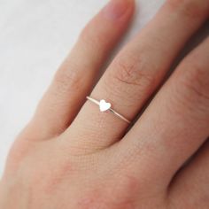 Dainty White Gold Heart Promise Ring, Dainty Heart-shaped Tiny Midi Rings, Dainty Hypoallergenic Heart Ring, Dainty Stackable White Gold Heart Ring, Simple Heart-shaped Stackable Promise Rings, Dainty Stackable Heart Ring In White Gold, Simple Heart Ring For Valentine's Day, Dainty White Gold Stackable Heart Ring, Dainty Hypoallergenic Heart Promise Ring