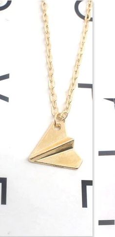 My Paper Airplane unisex necklace can travel wherever you take it. From the shower to oceans to pools and any other wet or dry climate, these planes are ready to XOGO. Paper Airplane Necklace, Airplane Necklace, Book Clock, Vintage Bookends, Tropical Home Decor, Paper Airplane, Paper Airplanes, Unisex Necklace, Travel Collection