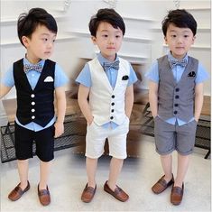 three young boys wearing vests and bow ties