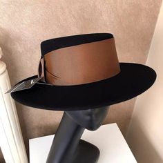 New Vintage Style Luxury Brown Hat For Fall, Modern Black Hat For Fall, Luxury Fitted Brown Hat, Elegant Brown Fedora For Fall, Luxury Black Fedora With Short Brim, Luxury Black Fedora With Flat Brim, Luxury Black Flat Brim Fedora, Luxury Black Wide Brim Fedora, Chic Fitted Brown Fedora