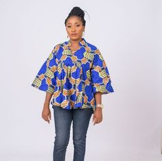 Fierce and feminine , this Ankara top has a unique in a relaxed, easy fit, oversize fit. You'll love how well it pairs with jeans and leggings bringing the high fashion drama you crave. V-neclline Short flared sleeves Cool iron as needed Pullover style Split-neck tunic Ankara Tops For Women, Ankara Plus Size, Ankara Tops, Women Blouse, Flared Sleeves, Traditional Outfits, Oversized Fits, Ankara, Pullover Styling