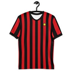 Inspired by the iconic 1982-83 AC Milan home shirt design. Get to know your new favorite tee - it's super smooth, super comfortable, and made from a cotton touch polyester jersey that won't fade after washing.  * 95% polyester, 5% elastane (fabric composition may vary by 1%) * Premium knit mid-weight jersey * Four-way stretch fabric that stretches and recovers on the cross and lengthwise grains * Regular fit * Blank product components in the US and Mexico sourced from the US * Blank product components in the EU sourced from Lithuania Graphic Print Jersey For Fan Apparel, Black Jersey Tops With Three Stripes, Black Jersey Top With Three Stripes, Cotton Jersey With Team Logo, Short Sleeve Jersey With Graphic Print For Fans, Graphic Print Short Sleeve Jersey For Fan Gear, Crew Neck Cotton Jersey With Team Logo, Cotton Fan Gear Jersey With Short Sleeves, Cotton Short Sleeve Fan Gear Jersey