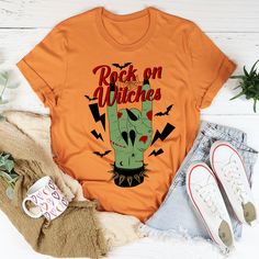 Rock On Witches Tee #dailyparenting #hotmess #millennialmom #teacherfashion #comfystyle #keepingitreal #peachysunday #sahm #women #igmoms Halloween Stretch Tops With Letter Print, Trendy Stretch Fall T-shirt, Trendy Stretch T-shirt For Fall, Stretch Graphic Tee For Fall, Faith Tees, Fall Tee, Rock On, Halloween Tees, Mom Tees