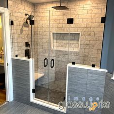 a walk in shower sitting inside of a bathroom