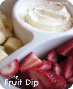 a bowl of fruit dip with sliced bananas and strawberries