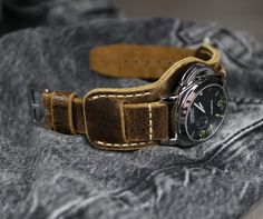 -Leather Watch Strap Brown of High quality. Will appeal to connoisseurs of vintage style. -Handmade leather cuff watch band for men is made of best English distressed leather.  -Bund strap is soft, comfortable, durable and sure to serve you for years. -The interchangeable strap is designed for everyday wear and will appeal to energetic and creative men.  -Luxurious And Thoughtful Gift. This leather strap will be a treat for any birthday, anniversary, holiday, or graduation gift. Watch band, designed and made by me from start to finish. I wanted the strap to be durable and comfortable so I chose distressed leather Crazy Cow. Leather from the legendary English manufacturer Charles F Stead. This is beautiful Premium Full grain Pull-Up, leather with a natural appearance lightens in colour when Vintage Brown Watches With Leather Strap, Vintage Brown Watch With Leather Strap, Vintage Brown Leather Strap Watch Accessories, Vintage Leather Strap Watch Bands For Everyday Use, Vintage Leather Strap Watch Accessories For Everyday Use, Vintage Watch Bands With Bracelet Strap For Everyday Use, Vintage Bracelet Strap Watch Bands For Everyday Use, Vintage Brown Leather Watch Band, Vintage Leather Strap Watch Accessories